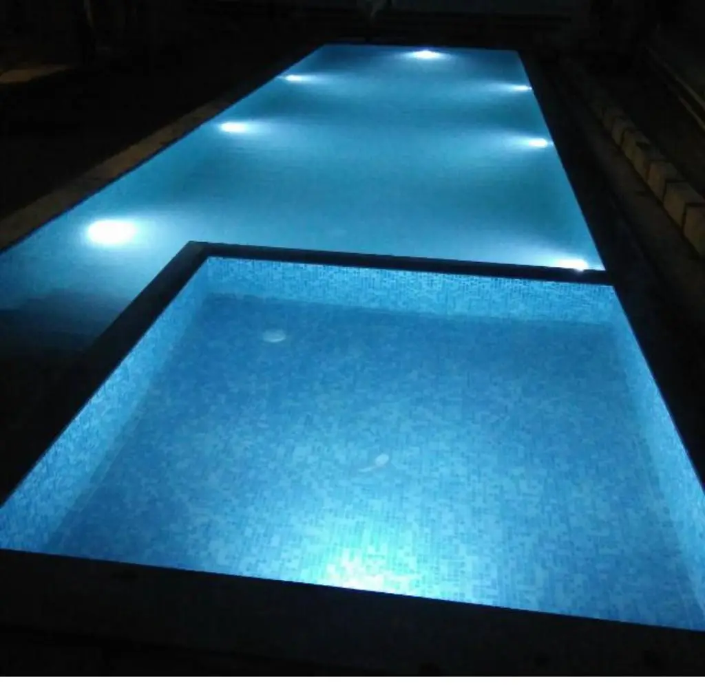 Close view of illuminated swimming pool water at night