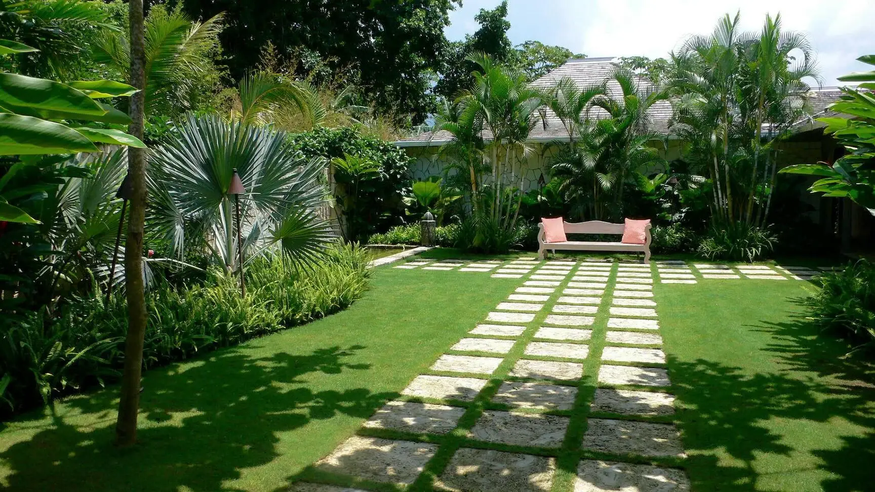 Garden pathway landscaping with greenery and outdoor walkway