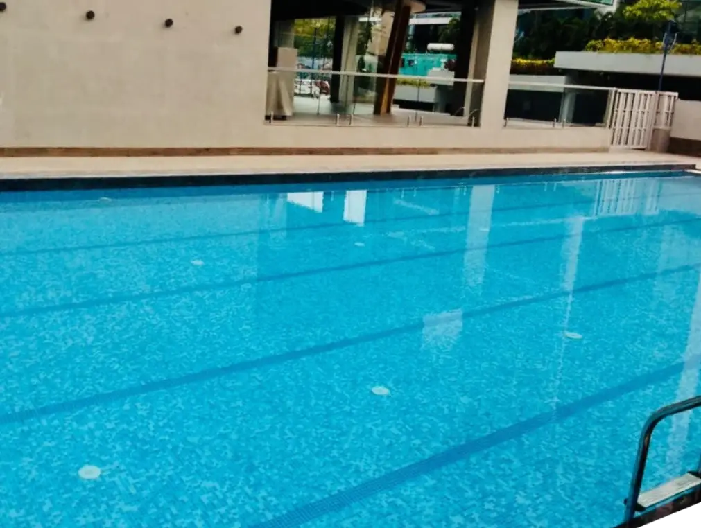 Outdoor residential swimming pool with deck area